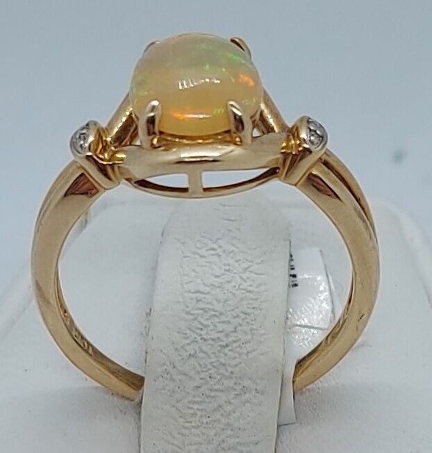 (N73983-1) 10k Yellow Gold Ladies Ring 1 Oval Cut Opal & 4 Diamonds