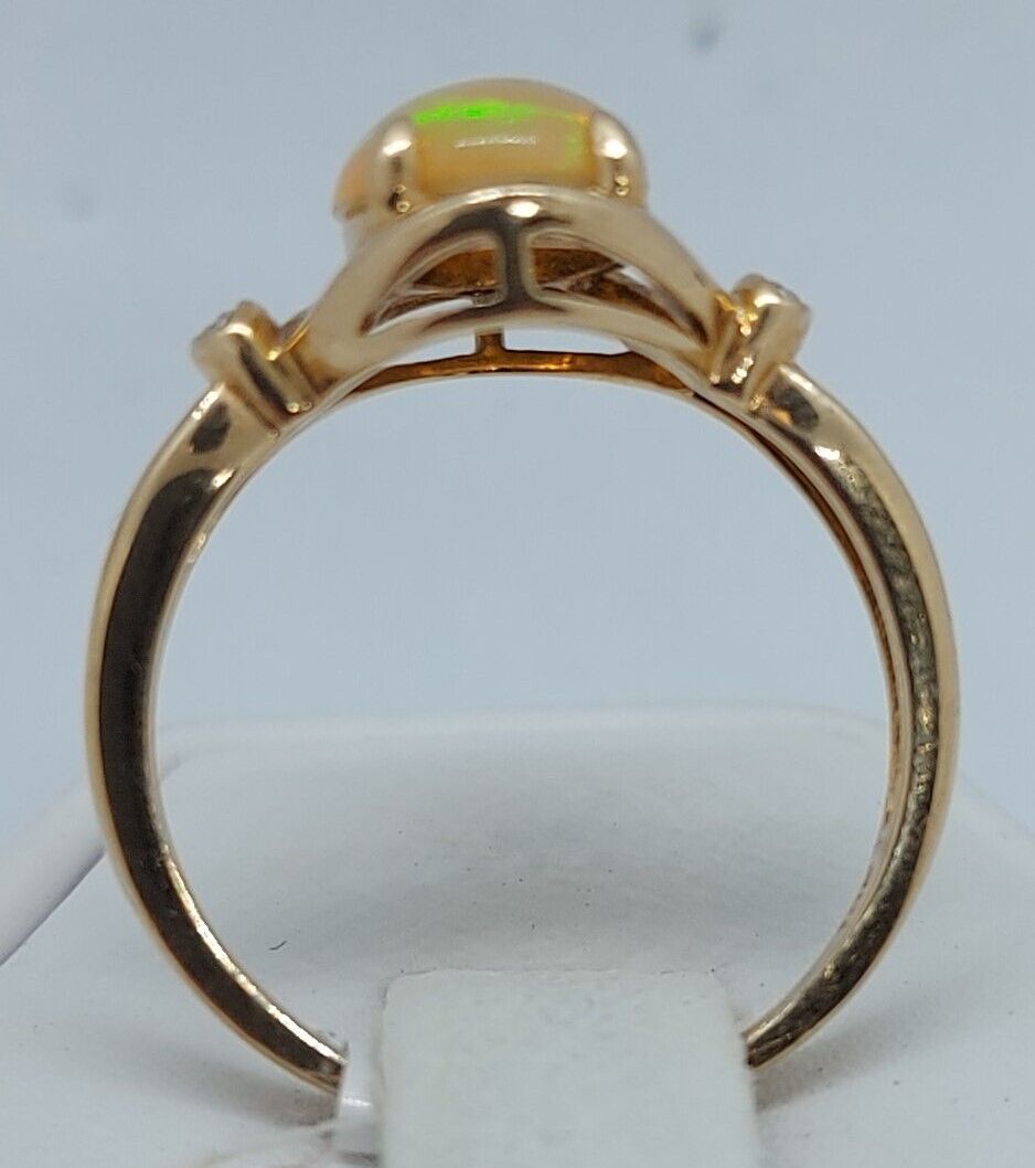 (N73983-1) 10k Yellow Gold Ladies Ring 1 Oval Cut Opal & 4 Diamonds
