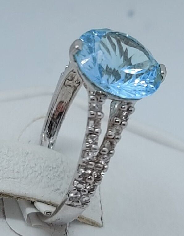 (N13604-3) 10K White Gold Ladies Ring 1 Blue Stone